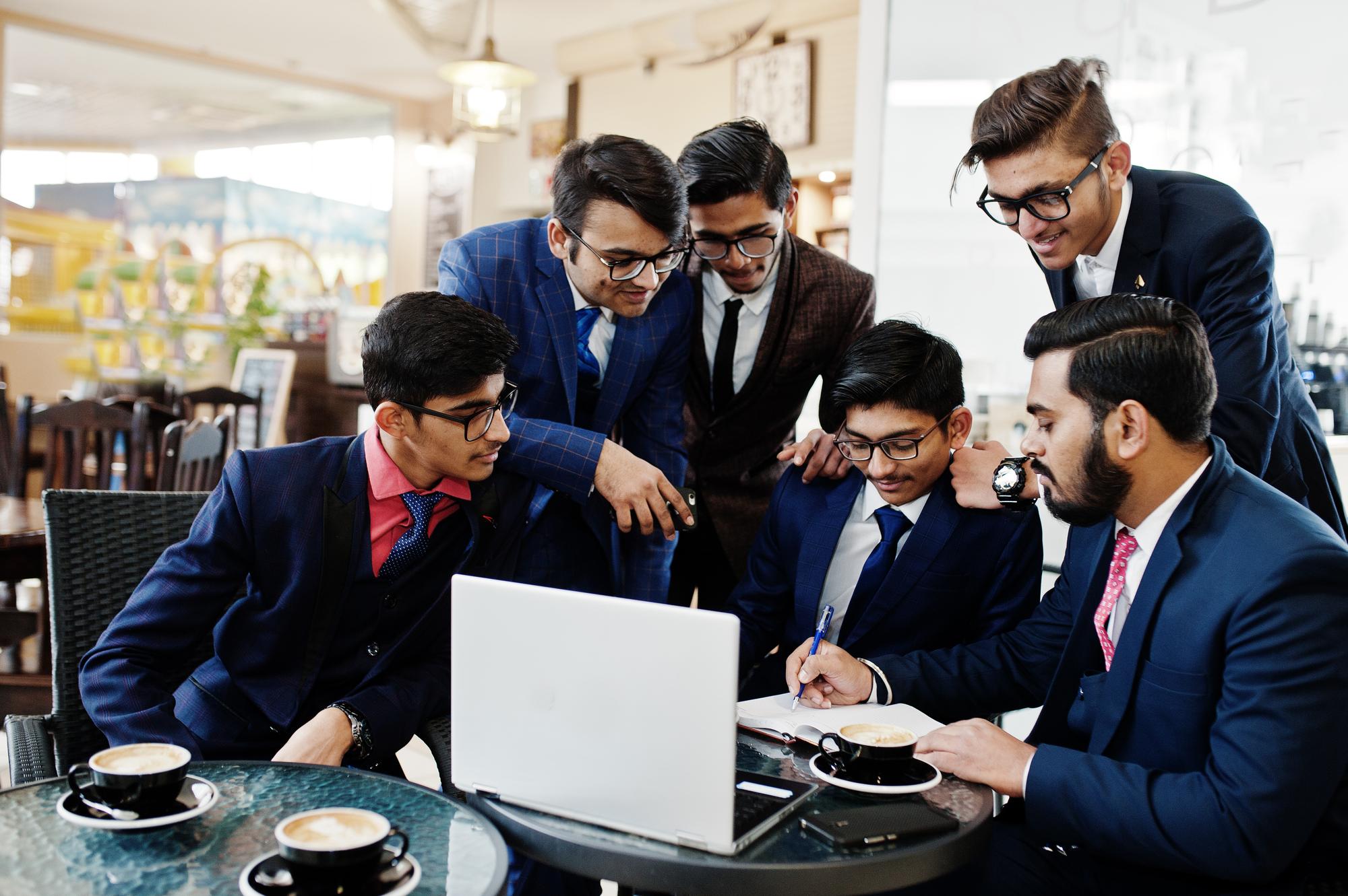 University students studying with teacher